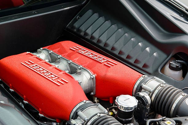 Modern hybrid supercar cornering on a professional racing circuit with dramatic tire smoke and aerodynamic downforce