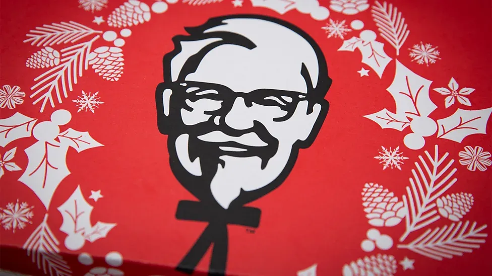 A Christmas-themed KFC box from Japan featuring an illustration of Colonel Sanders