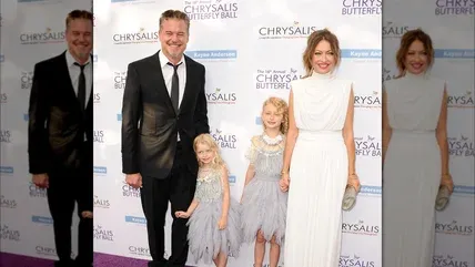 Eric Dane and Rebecca Gayheart smiling with their daughters