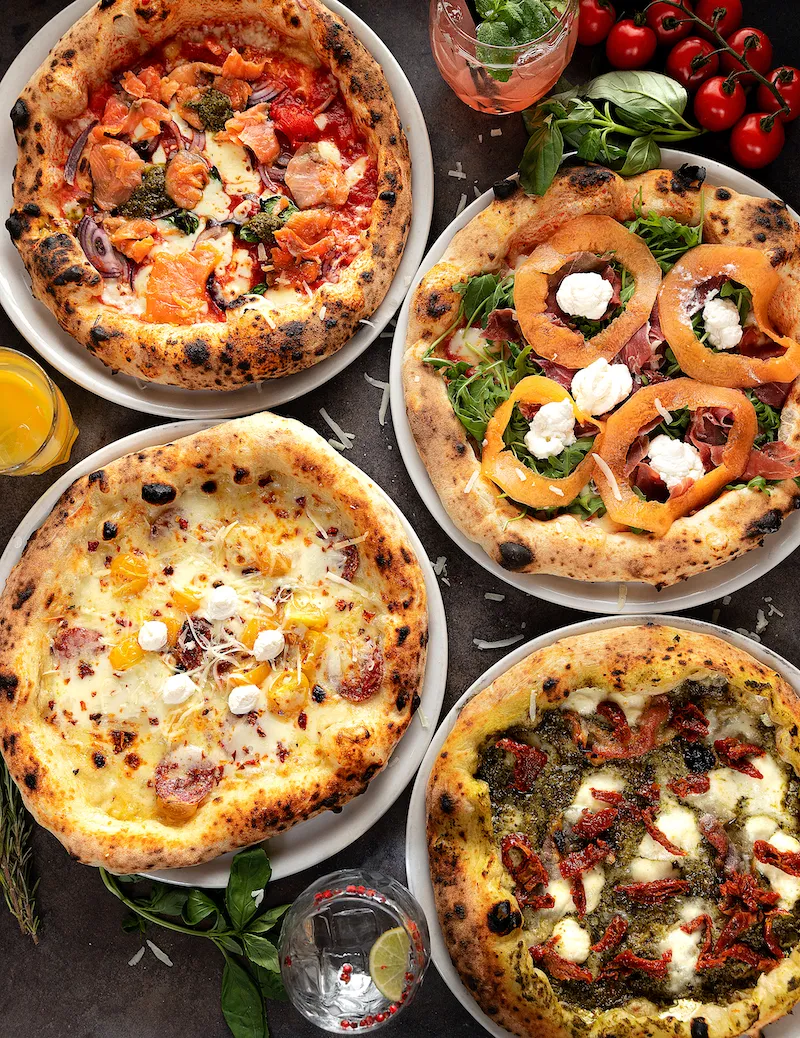 Selection of seasonal pizzas at UNA Pizza