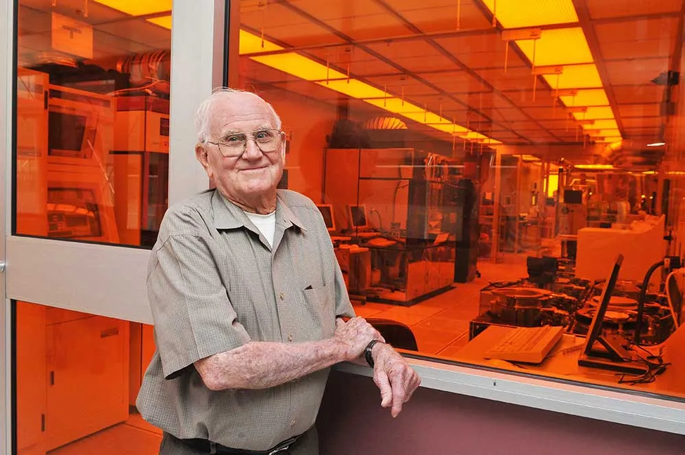Willis Whitfield standing outside a clean room facility at a research complex