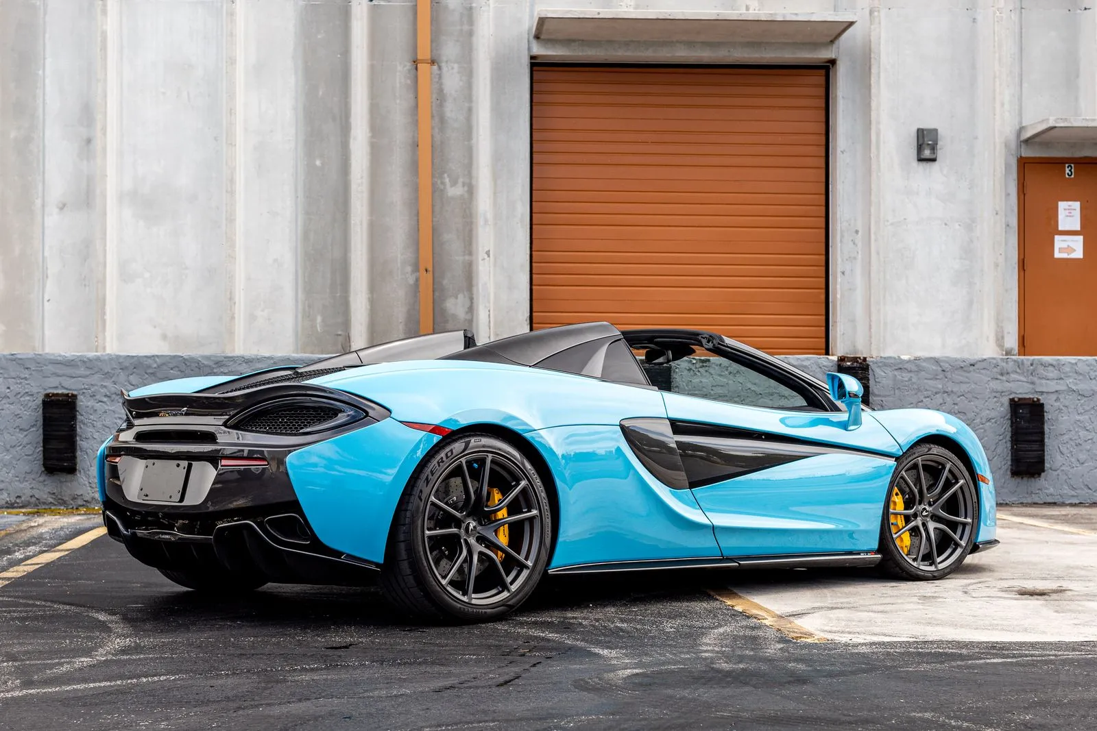 McLaren 570S front end detail showing headlights and splitter