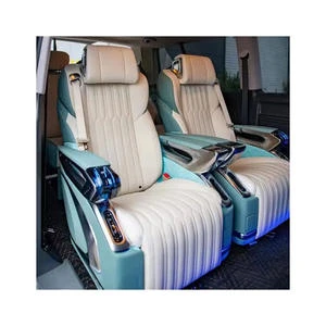 Exquisite handcrafted leather rear seats inside a luxury executive sedan with plush headrests and wood veneer trim
