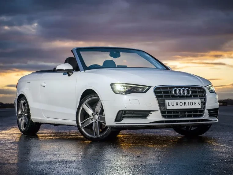 Luxury convertible car prepared for self-drive or chauffeur service with keys and premium interior visible