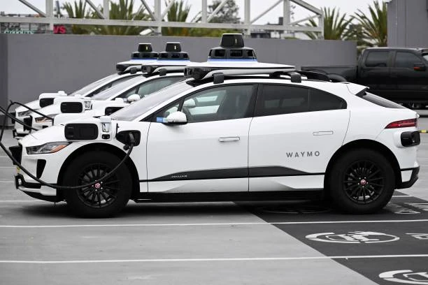 A 2022 electric SUV parked at a fast-charging station showcasing modern EV design and range capability