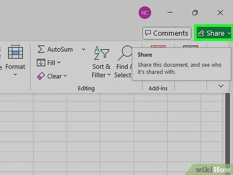 Hands navigating an Excel sharing workflow with cloud storage and permission options on a computer screen