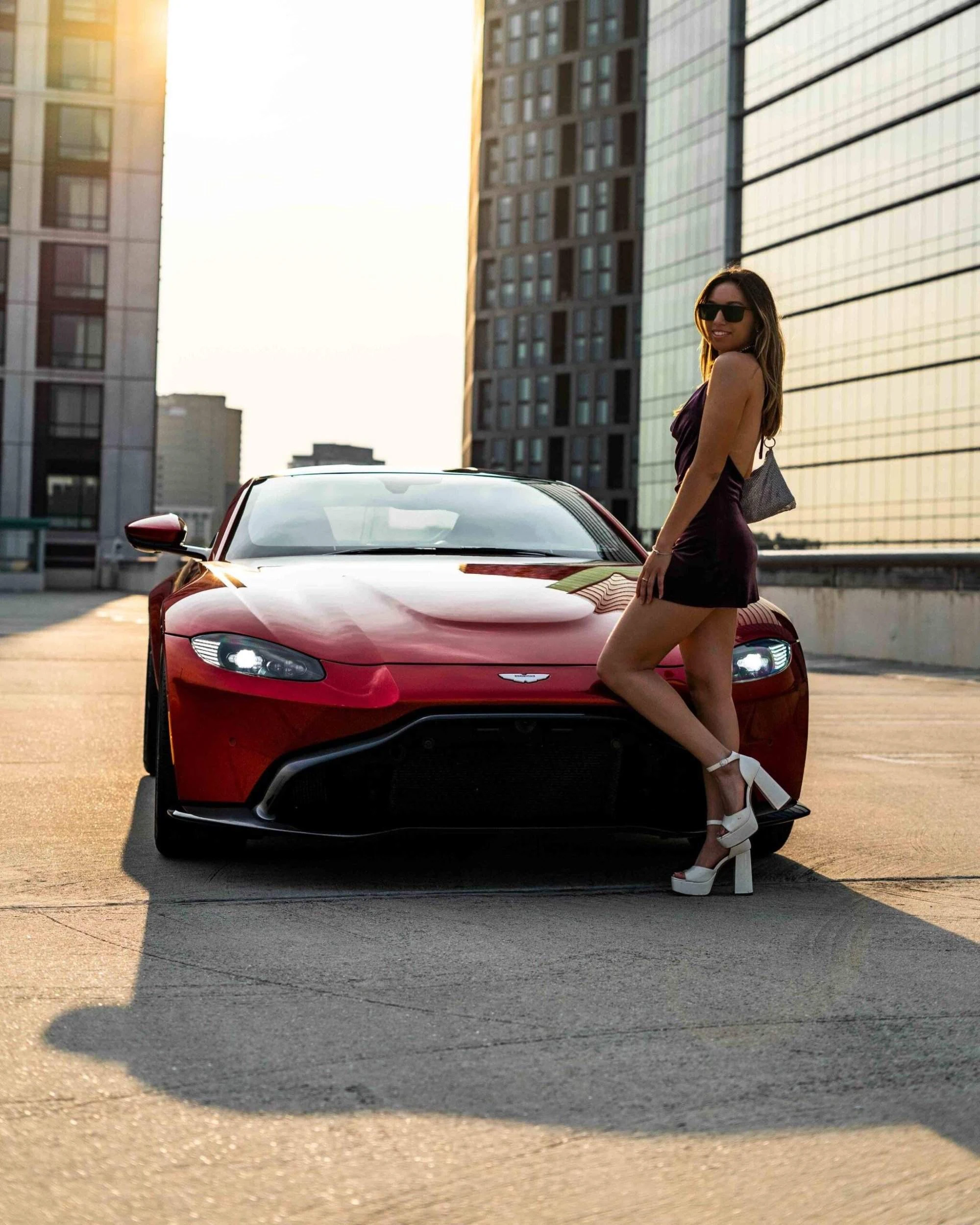 Exotic car rental fleet displayed in a major U.S. city setting with premium vehicles ready for travelers