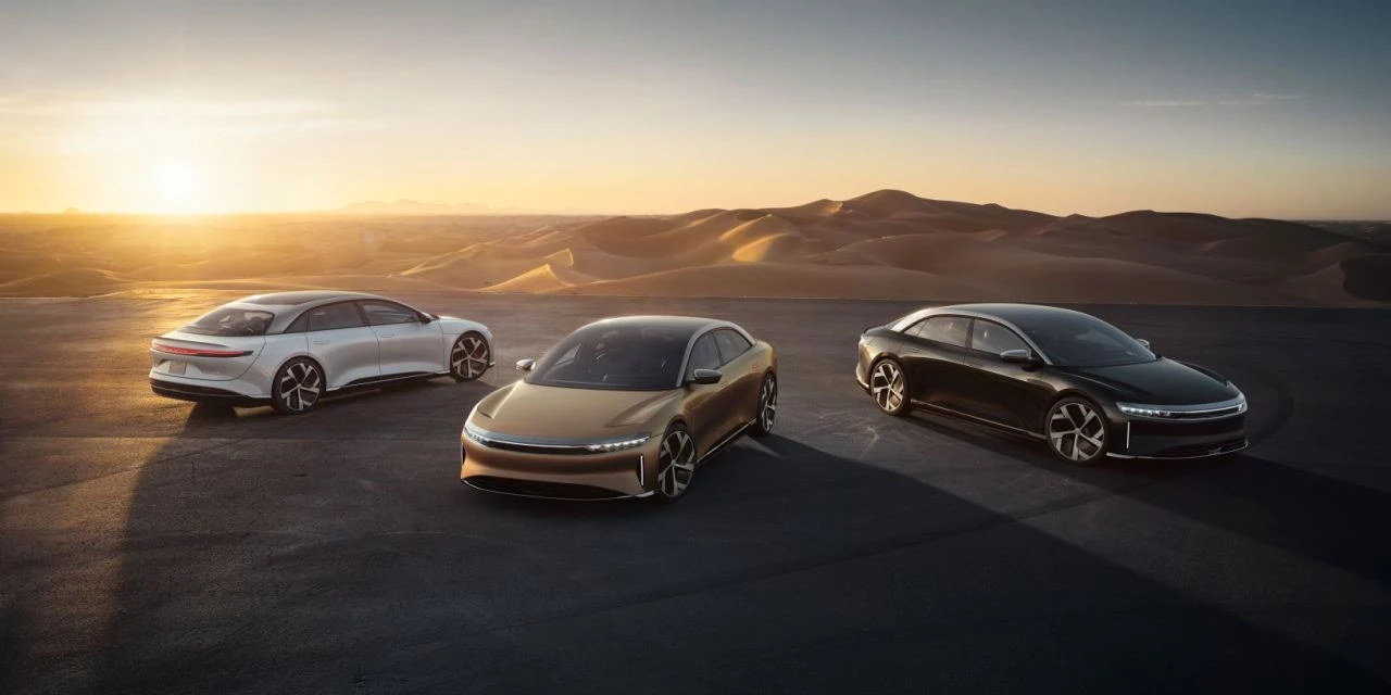 Lucid Air luxury sedan with sleek aerodynamic lines and open cabin view