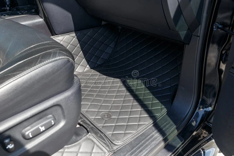 Close-up of handcrafted leather seats and wood trim in an ultra-luxury vehicle interior