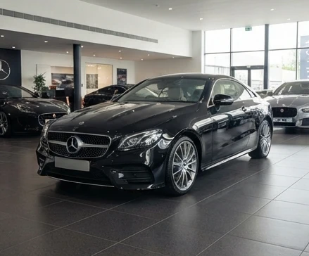 Well-maintained luxury vehicle prepared for resale evaluation with premium dealership setting