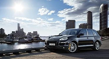 Luxury Cars of Lexington inventory featuring curated pre-owned sedans and SUVs in a modern showroom