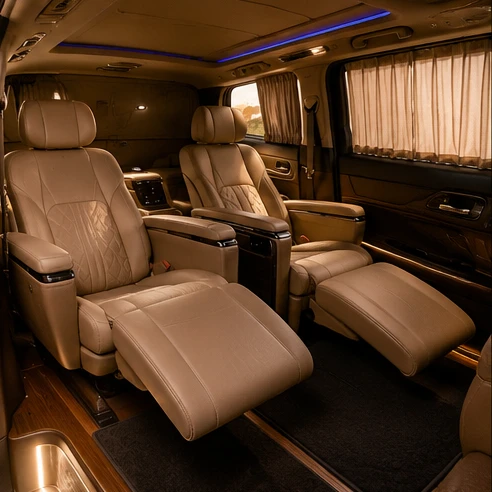 High-end luxury MPV cabin featuring reclining captain seats with footrests and panoramic glass roof