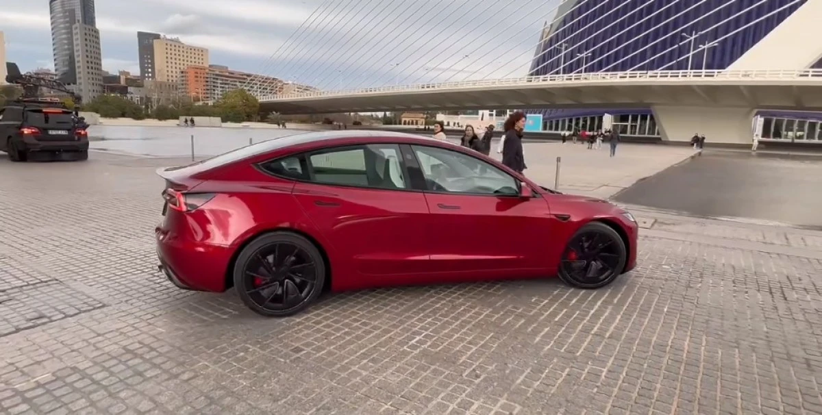 Tesla Model 3 Performance horsepower shown through a high-performance electric sedan driving scene