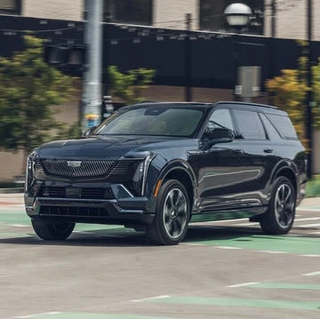 Electric SUV rear cargo area open with practical storage space for daily family items and equipment
