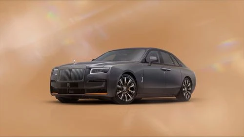 Rolls-Royce Ghost luxury sedan in three-quarter view highlighting the signature grille and Spirit of Ecstasy ornament