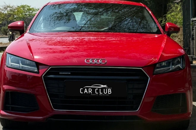 Used luxury cars in Ernakulam displayed in a premium setting with polished vehicles and elegant interiors